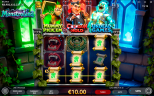 Monstroland slot gameplay by Endorphina showing the main game reels with glowing green scroll symbols forming a €5 winning payline, while the Mummy, Dracula, and Frankenstein’s monster appear above the reels with their three Bonus Games.